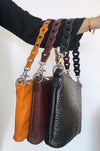 Style Kiss i rusten orange. Clutch, håndtaske og skuldertaske i skind med flot prægning Octopus Denmark